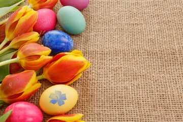 Spring tulips with colorful easter eggs.