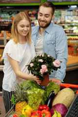 Young couple in love buying flowers