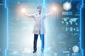 Doctor in futuristic medical concept pressing button