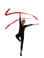 Young girl doing gymnastics with ribbon on white background