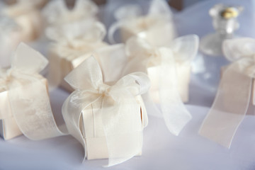 Obraz na płótnie Canvas Gift boxes for wedding day on organza