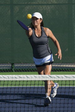 Pickleball Action - Attractive Senior Women Hitting Ball