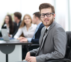 Face of  smart businessman on the background of business people