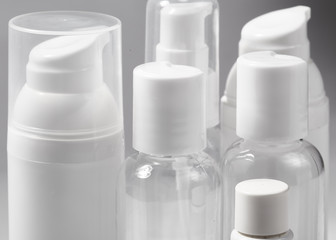 White cosmetic bottles on white background. Wellness, spa and body care bottles collection. Beauty treatment