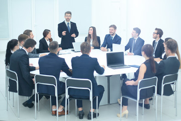 Director of the company discussing work problems at the meeting