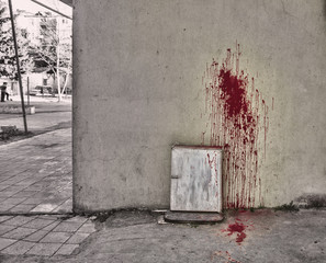 Splattered blood stain on white background. Halloween background. Blood on wall and ground.