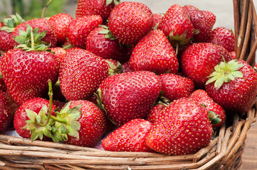 Fresh strawberries in a straw basket. Strawberry