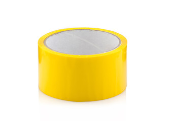 Yellow roll of duct tape, isolated on white background.