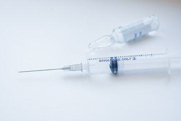 A medical syringe with a medicine for injecting a patient against a disease