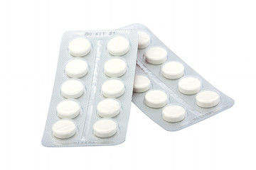 Packing of white tablets on a white background. Isolated