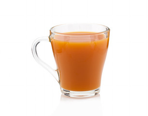 Carrot juice in a transparent cup on a white background. Isolated