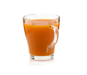 Carrot juice in a transparent cup on a white background. Isolate
