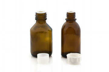 Vial of medicine without a lid on a white background