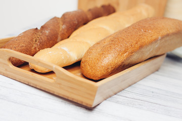 loaf and baguettes on a tray