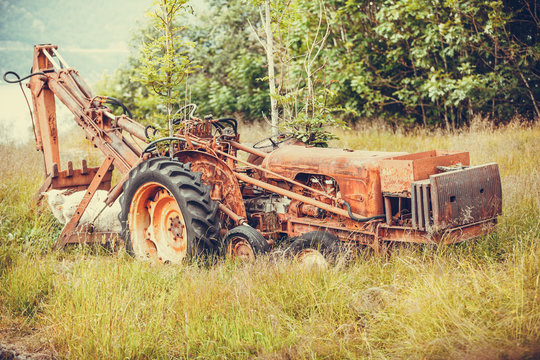 Old agricultural machinery covered with rust