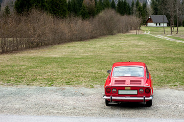 red retro car in the nature