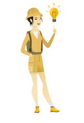 Asian traveler pointing at idea light bulb.