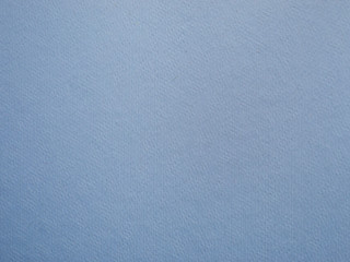 Blue background of textured paper.