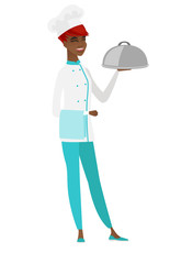 Chef cook holding towel and cloche.