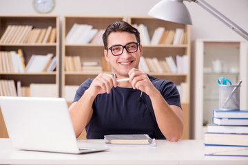 Young freelance worked working on computer