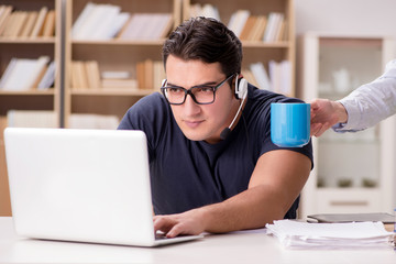 Young student drinking coffee from cup