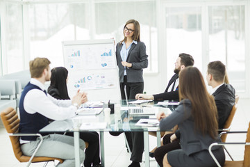  business team gives a presentation of a new financial project for the business partners of the company