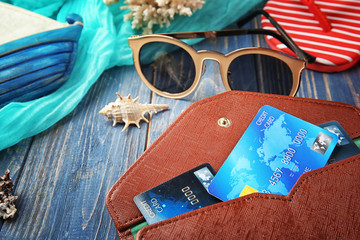 Credit cards in wallet on wooden background