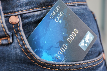 Credit card in pocket of jeans, closeup