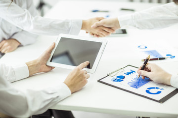 handshake Manager and client on a background of bright office .the photo has a empty space for your text