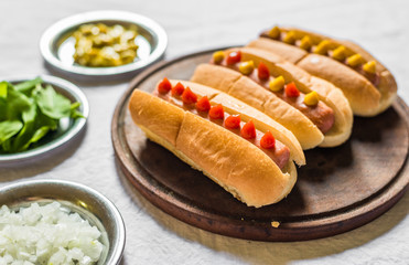 Selection of classic hot dogs against white background