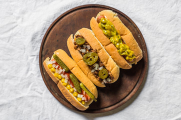 Selection of classic hot dogs against white background