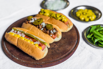 Selection of classic hot dogs against white background