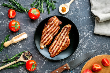 restaurant kitchen with steak preparing on wooden background top view