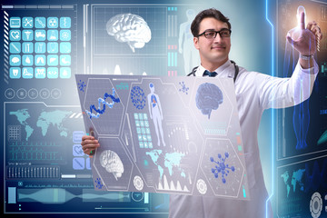 Young male doctor in futuristic medical concept