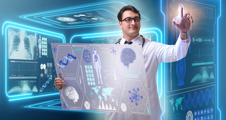 Young male doctor in futuristic medical concept