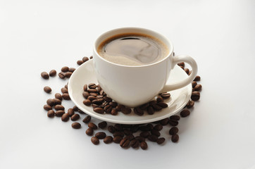 Coffee cup and saucer , coffee beans on a white background.