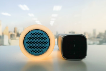 close up glow speaker in orange color and modern wireless speaker for listening to music