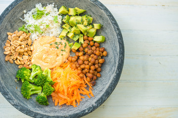 Nice image of a mixed salad on a wooden table.