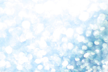 Blue bokeh texture. Festive glitter background with defocused lights