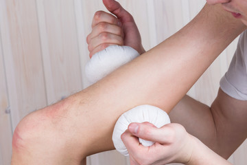 foot massage with herbal bags