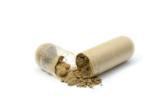 herb capsule with green herbal on white