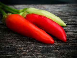 hot chili peppers on the old wood in nature.