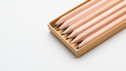 Sharpen pencils in brown box on white background