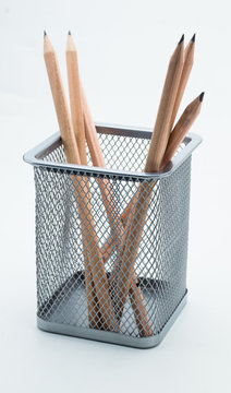 Sharpen pencils in metal box on white background