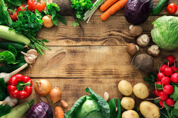 Frame of different vegetables on a wooden table