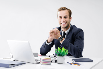Businessman with laptop at office