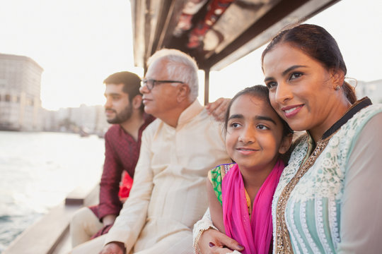 Family traveling on boat at Dubai Creek.