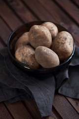 Unpeeled raw potatoes