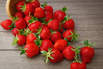 Strawberry in bowl on wooden
