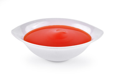 tomato sauce in a cup on white background